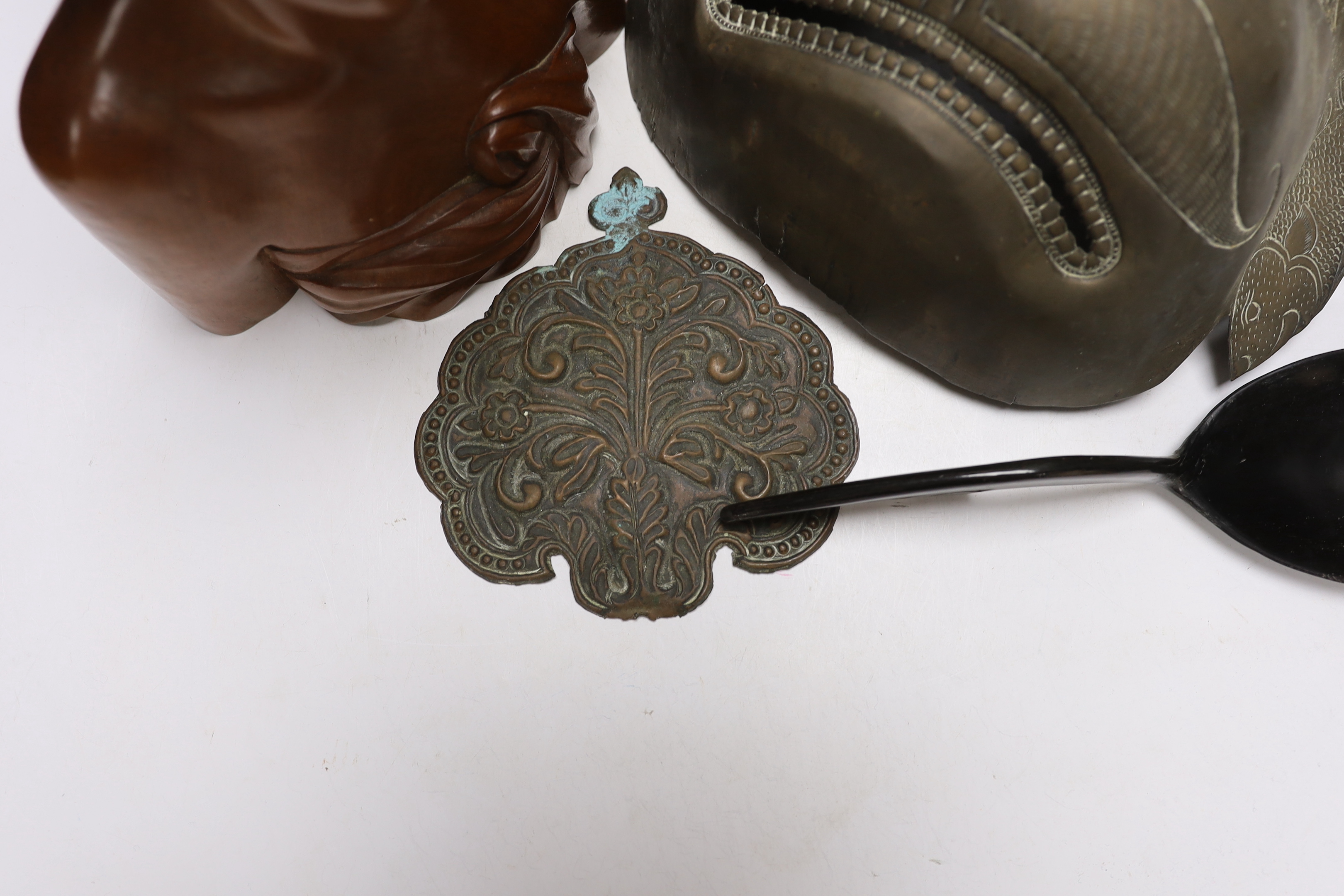 A West African carving of a girl, and a Balinese bust of a man together with an Indonesian metal mask and black lacquered spoon, mask 38cm high